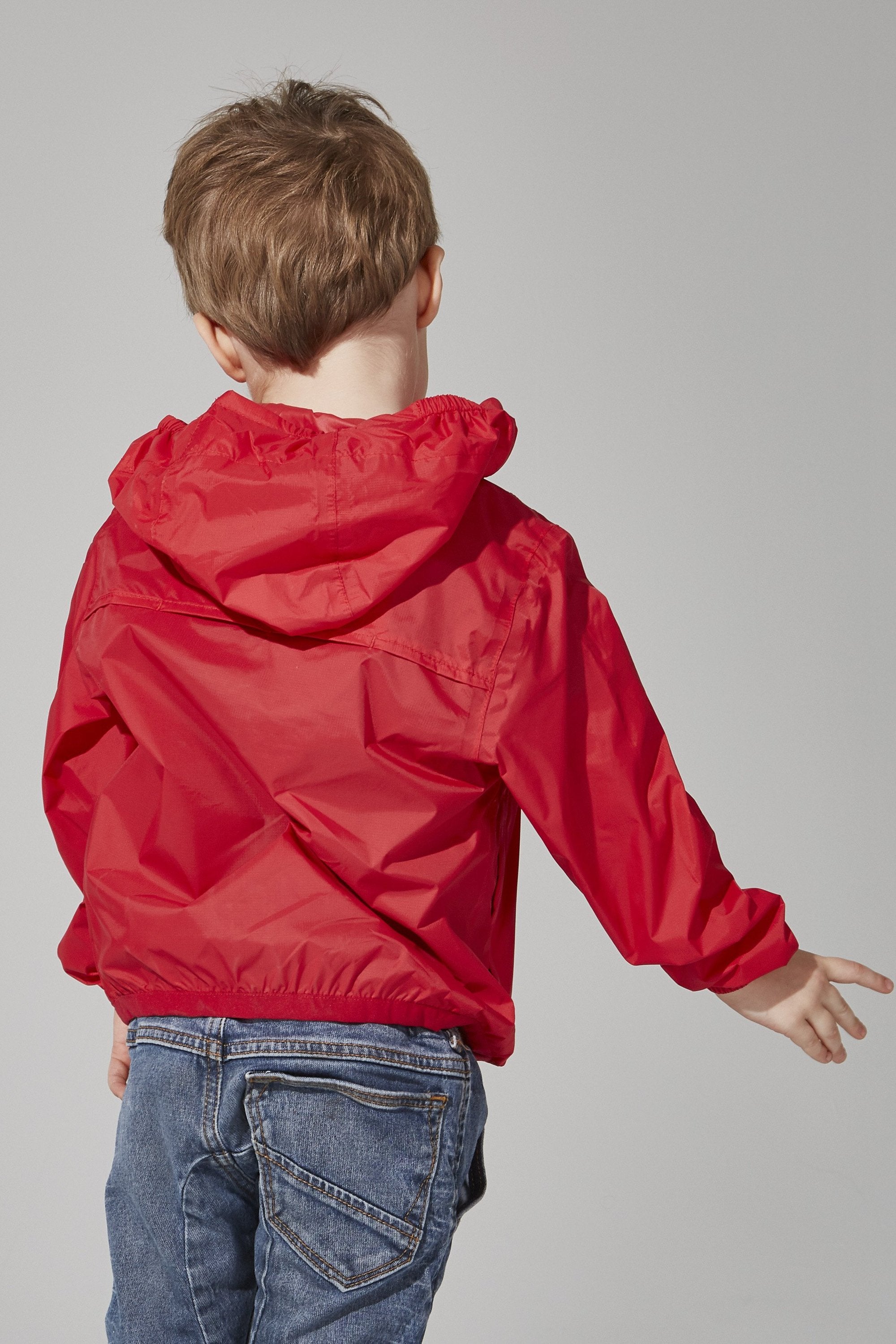 Kids red full zip packable rain jacket and windbreaker - Horizon Bliss